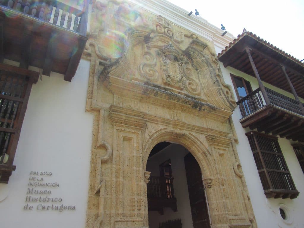 The arched entryway into the colonial building housing the Cartagena Inquisition Museum, a what to do in Cartagena Colombia.
