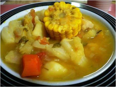 Photo of a bowl with corn and other vegetables in a sancocho, another one of the foods you should try in Cartagena.