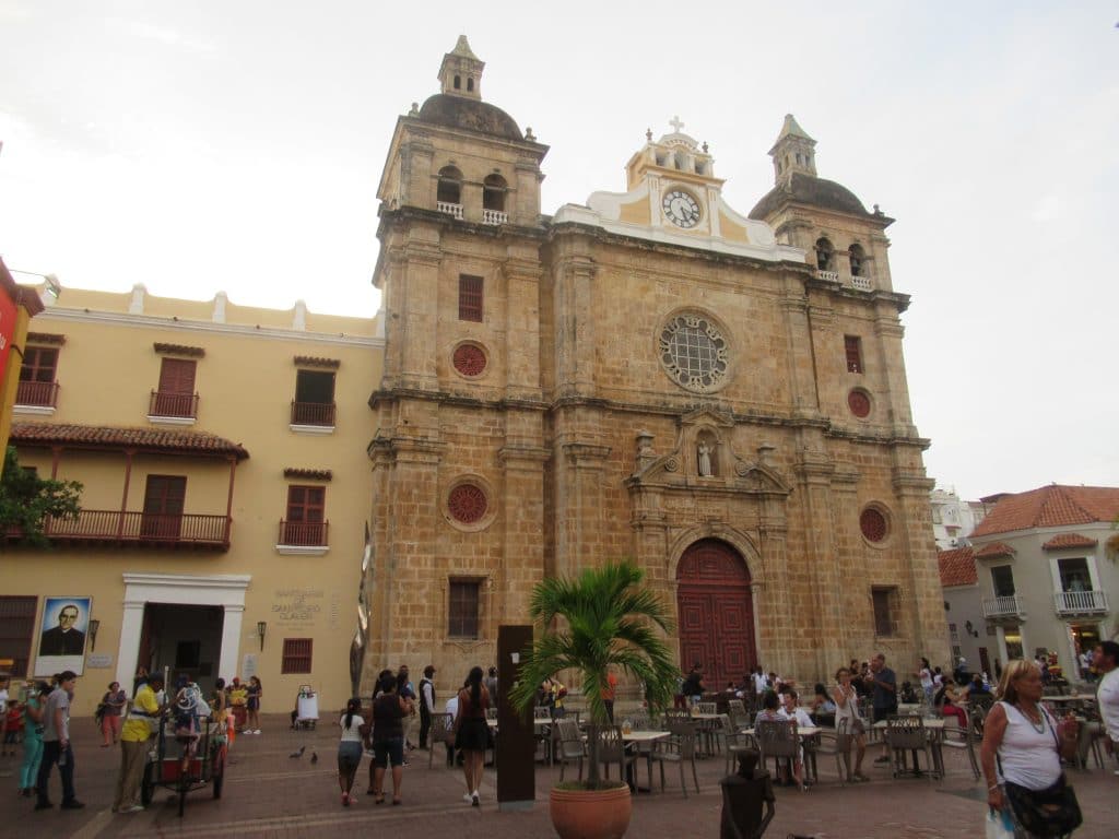 Photo showing people standing in front of the San Pedro Claver Church seeing things to do in Cartagena Columbia.