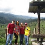 Photo of 4 people standing overlooking the hills in Salento, Colombia