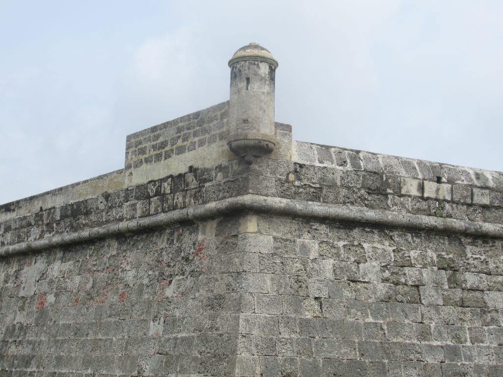 Photo of a corner of the historic wall in Cartagena, looking much how it might have looked during the Battle of Cartagena de Indias.