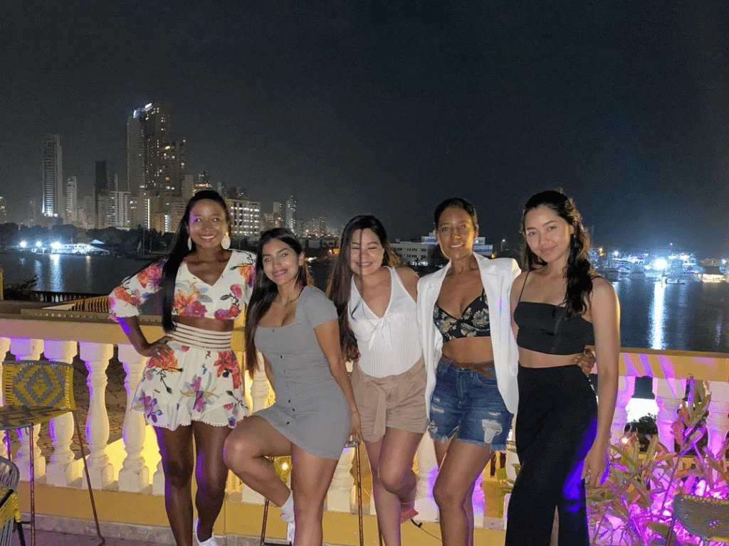 Photo of a group of girls on the rooftop at Selina Hostel another one of the places to visit in Cartagena Colombia.