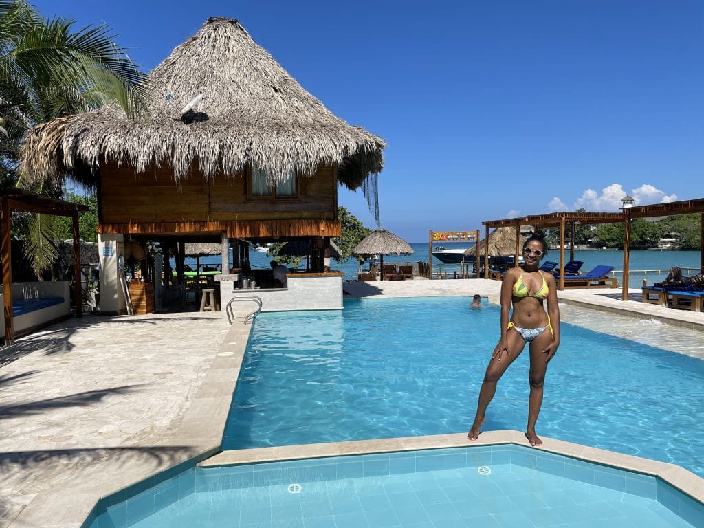 Photo of a girl standing in front of the pool at Isla del Sol Hotel.