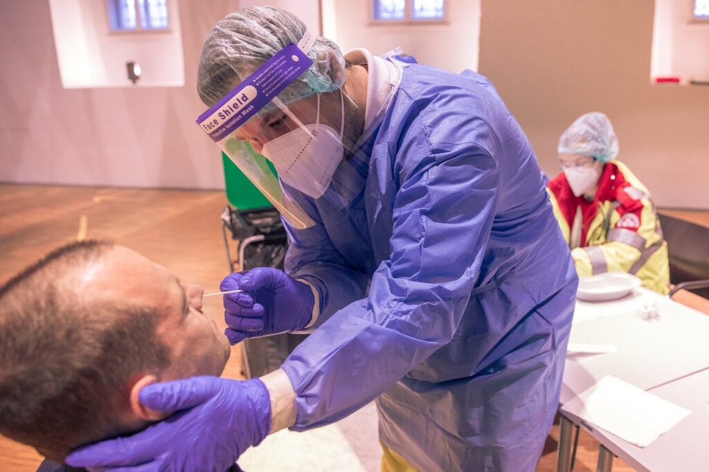 Photo of a doctor administering a nasal swab like someone getting a test at a Cartagena Covid testing location.
