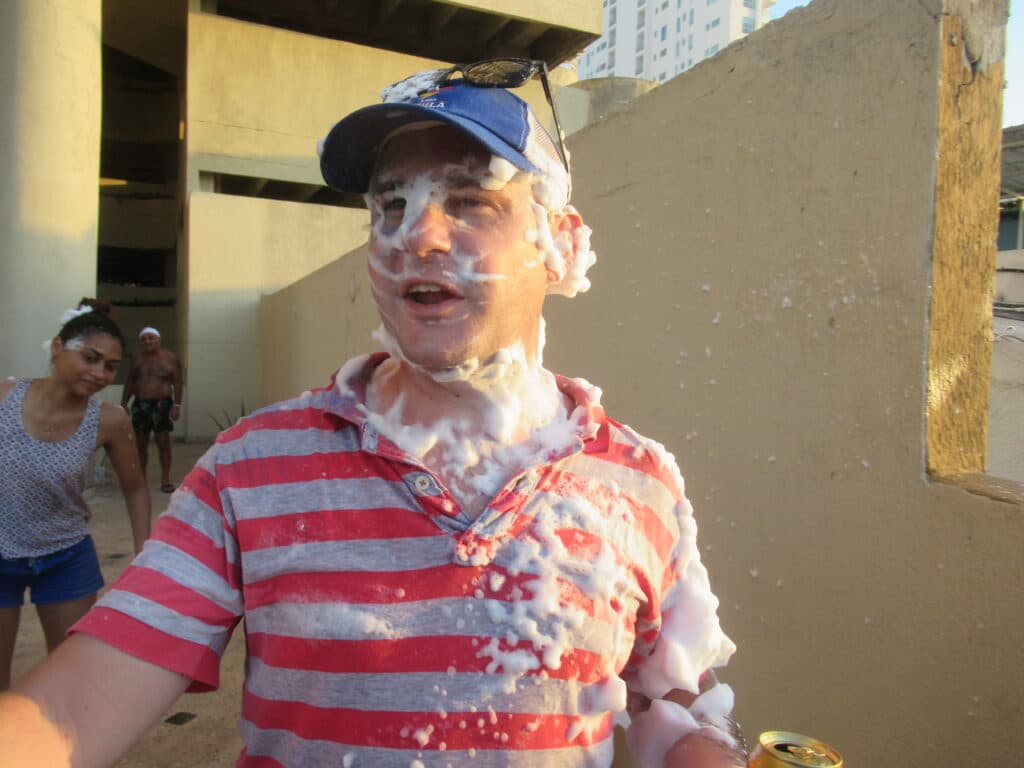 A guy covered in foam during the festivities of Cartagena Independence Day in Colombia.