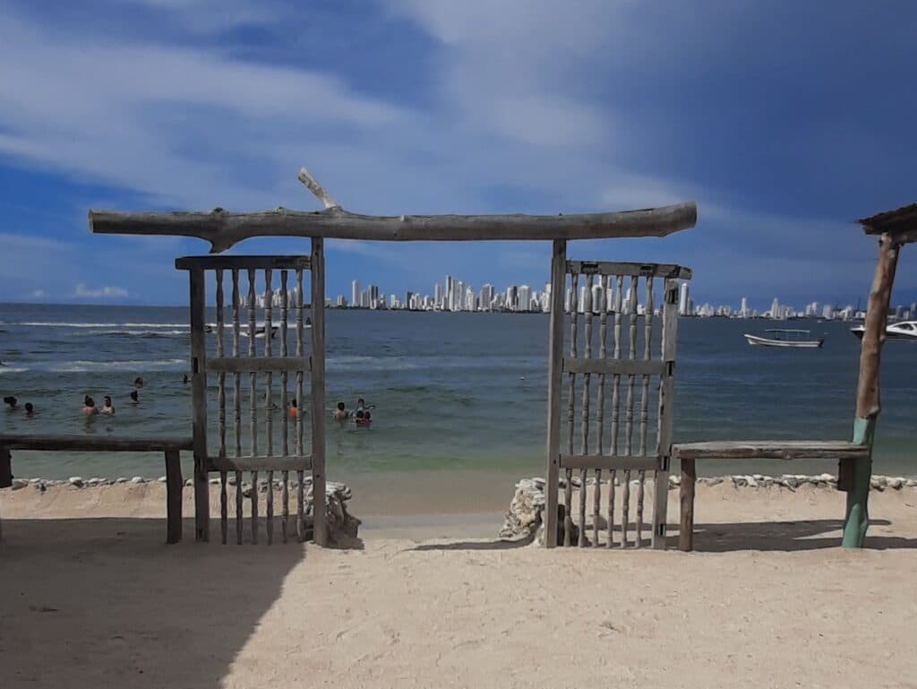 Photo of a wooden doorway looking out over one of the beaches Cartagena.