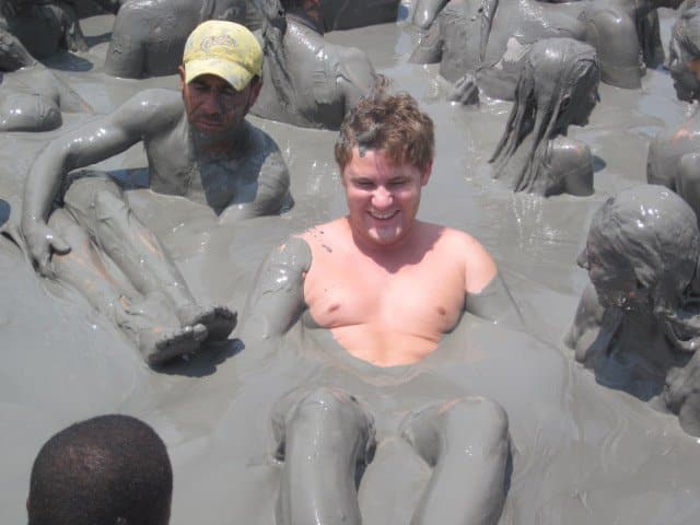 Photo of a guy making a funny face in the mud volcano Cartagena.