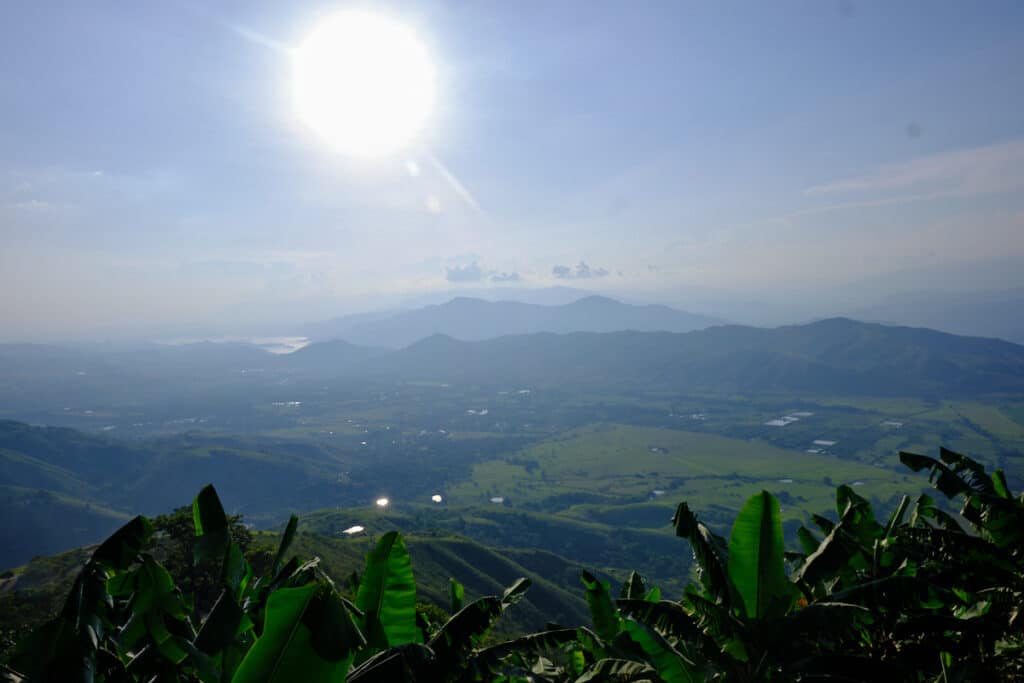Photo of a valley with mountains.