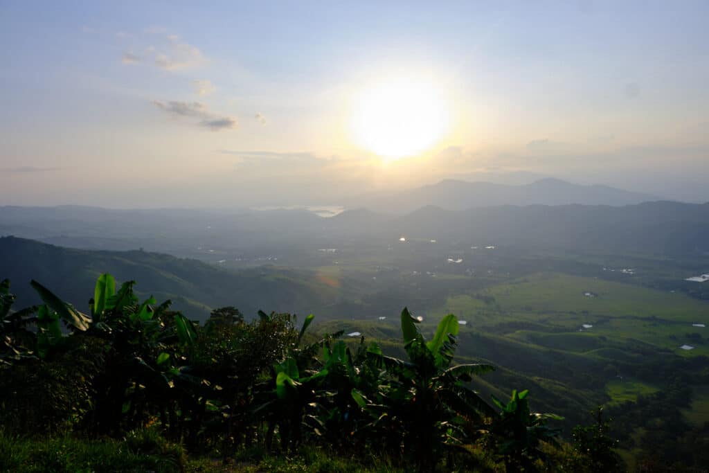Photo of a valley with the sun setting,