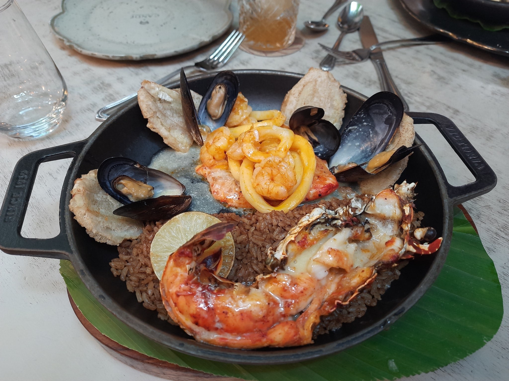 Seafood in a cast iron skillet.