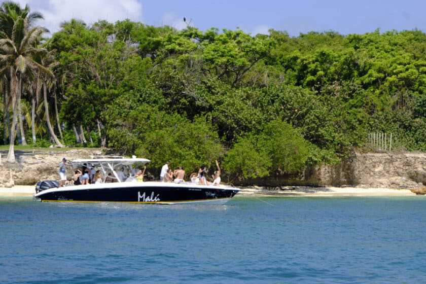 People dancing on a Cartagena boat hire in the Rosario Islands.